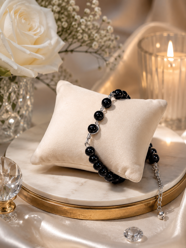 Adjustable ebony bead bracelet with glossy black round beads on lightweight wire