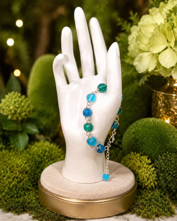 Royal sapphire moss bracelet with twisted wire design and round blue glass beads, adjustable fit
